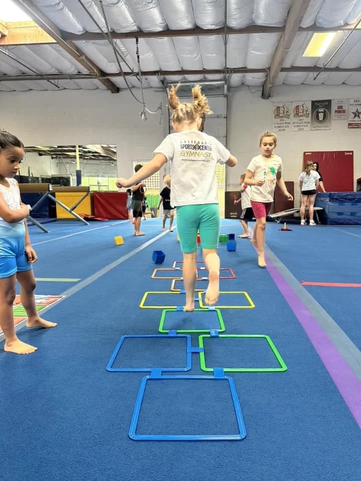 girl doing hop scotch